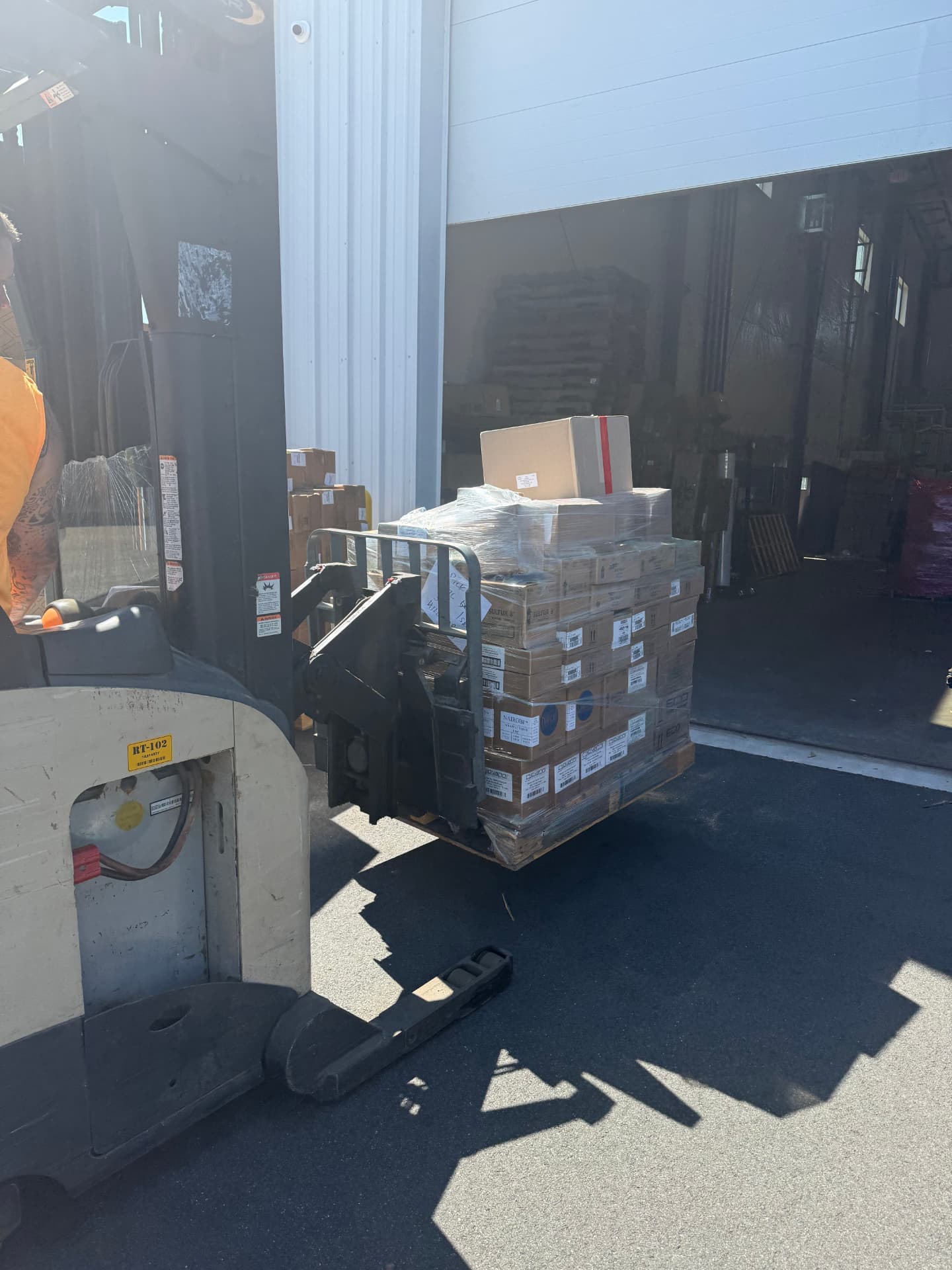 Forklift loading a wrapped skid at the Hillsborough loading bay.